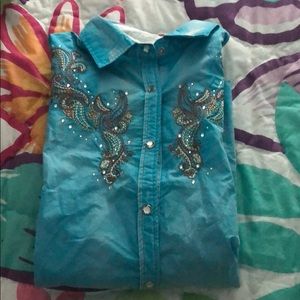 A blue long sleeve show shirt